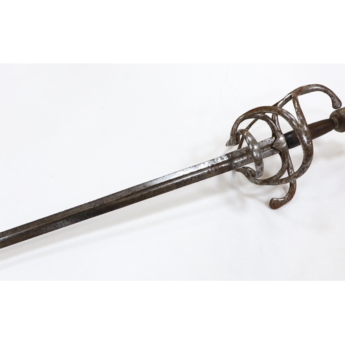 251 - A swept hilt rapier, c.1620, blade fullered at the forte, iron guard of conventional form with later... 