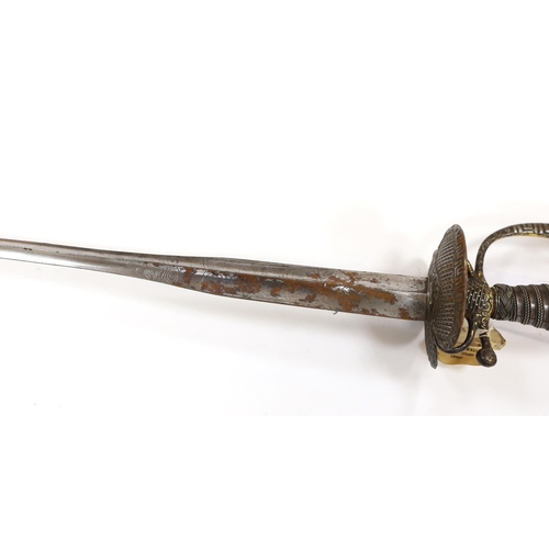 255 - A French iron hilted small sword, hilt with flutes and tiny gold dots, the knuckle guard with key de... 