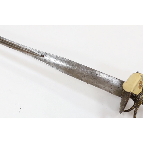 255 - A French iron hilted small sword, hilt with flutes and tiny gold dots, the knuckle guard with key de... 