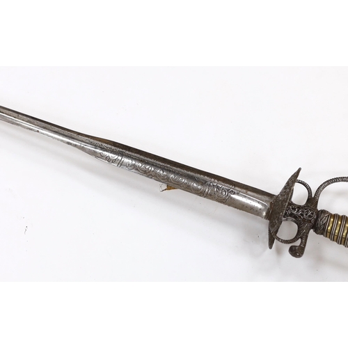 256 - An English iron hilted small sword, c.1765, chiselled and pierced with scrolling devices and foliage... 