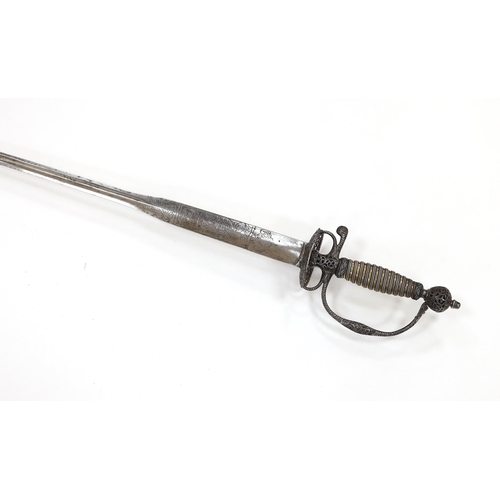 256 - An English iron hilted small sword, c.1765, chiselled and pierced with scrolling devices and foliage... 