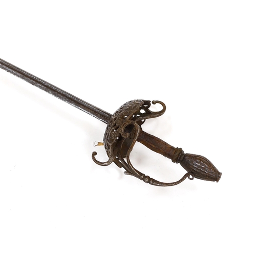 259 - A mid 17th century English rapier, with pierced and chiselled cup guard, steel pommel and leather gr... 