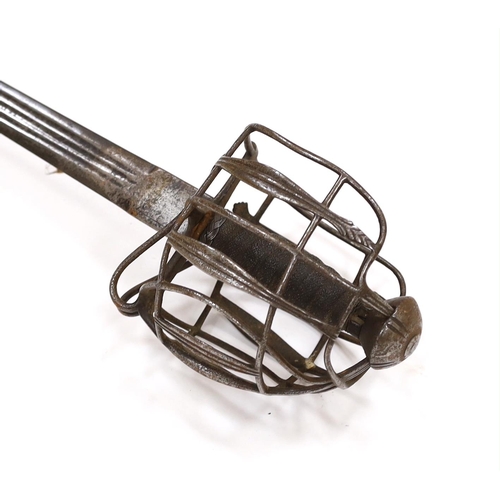 261 - An early 18th century Scottish or English broadsword, with steel basket and pommel and triple fuller... 