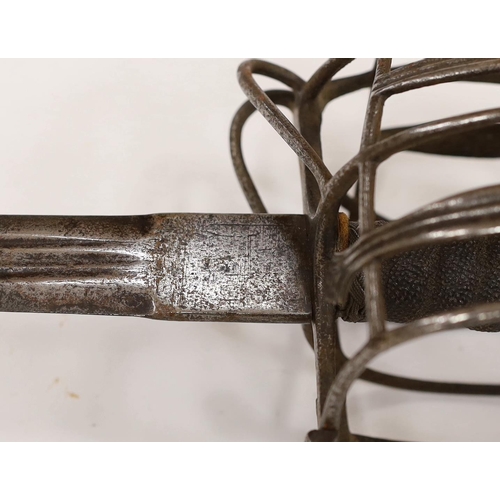 261 - An early 18th century Scottish or English broadsword, with steel basket and pommel and triple fuller... 