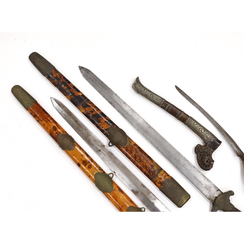 274 - Two Chinese short swords (Jian) in faux tortoiseshell veneered scabbards and a Sumatran knife dagger... 