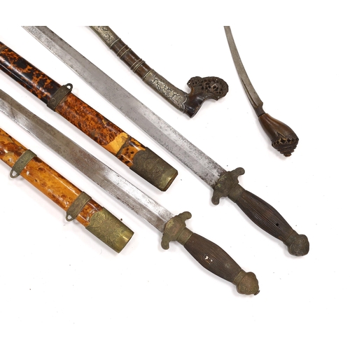 274 - Two Chinese short swords (Jian) in faux tortoiseshell veneered scabbards and a Sumatran knife dagger... 