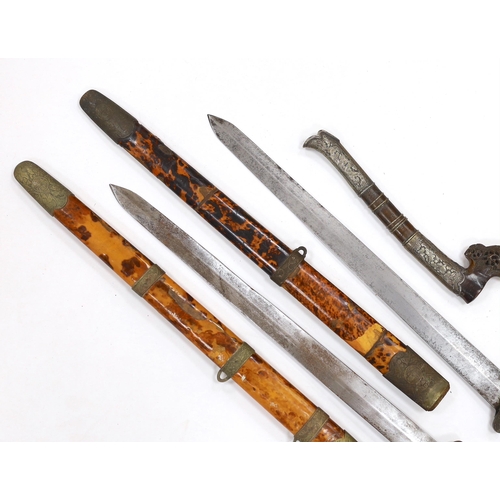 274 - Two Chinese short swords (Jian) in faux tortoiseshell veneered scabbards and a Sumatran knife dagger... 