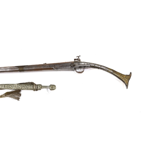 275 - A 19th century Albanian flintlock miquelet lock rifle (Balkan long arm) and a Caucasian style dagger... 