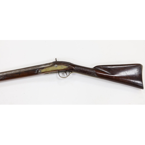 284 - A 1786 percussion 12 bore fowling piece, converted from flintlock, with a fully stocked half octagon... 