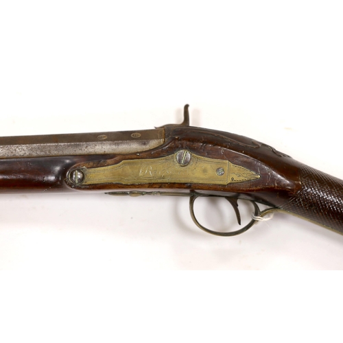 284 - A 1786 percussion 12 bore fowling piece, converted from flintlock, with a fully stocked half octagon... 