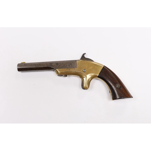 297 - A 19th century miniature percussion pistol with brass lock and octagonal barrel, stamped Morgan and ... 