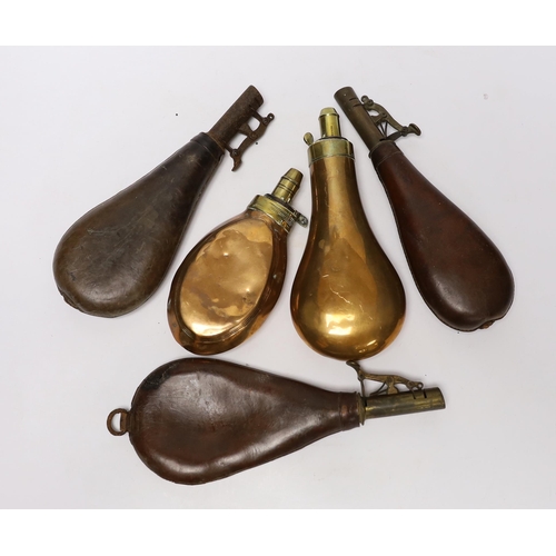 299 - Five powder flasks; two with copper pouches and three with leather pouches