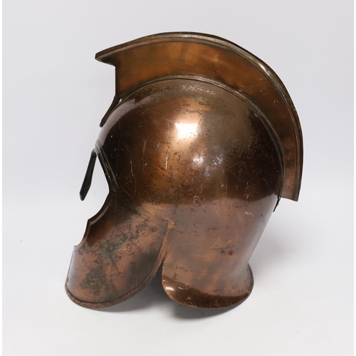 306 - A copper gladiator's helmet, 32cm high