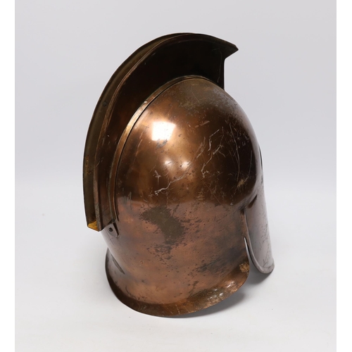 306 - A copper gladiator's helmet, 32cm high