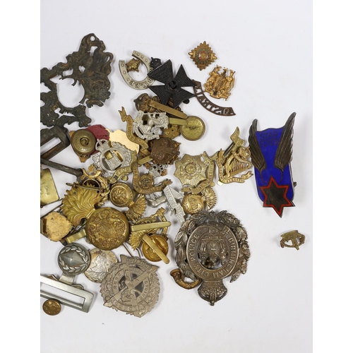 323 - Eighteen military cap badges including Northumberland Fusiliers, East Yorkshire, SWB, the Suffolk Re... 