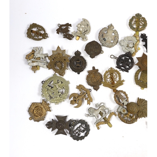 324 - Forty military cap badges including City of London Cyclists, Lincolnshire Yeomanry, Connaught Ranger... 