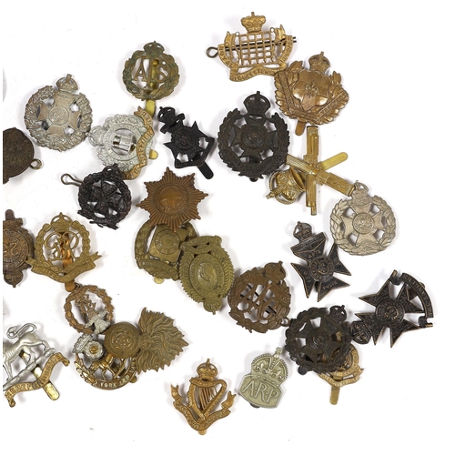 324 - Forty military cap badges including City of London Cyclists, Lincolnshire Yeomanry, Connaught Ranger... 