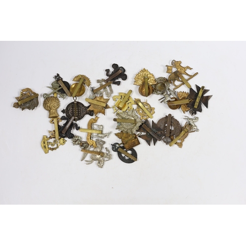 325 - Thirty military cap badges including Royal Warwickshire, Hampshire Yeomanry Carabiniers, Inniskillin... 