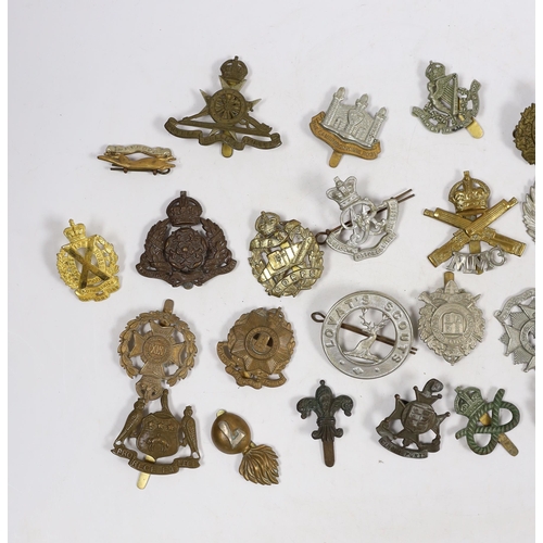 326 - Thirty military cap badges including Royal Canadian Engineers, Royal Gloucestershire Hussars, the Ro... 