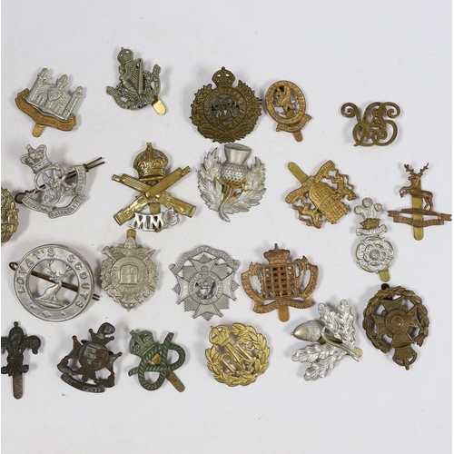 326 - Thirty military cap badges including Royal Canadian Engineers, Royal Gloucestershire Hussars, the Ro... 