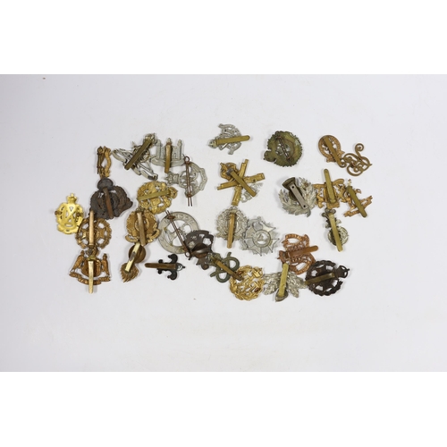 326 - Thirty military cap badges including Royal Canadian Engineers, Royal Gloucestershire Hussars, the Ro... 