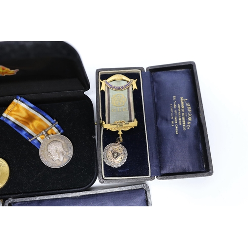 329 - WWI trio awarded to CMT - 735 PTE A E COX ASC, three cased silver Masonic medals, two with enamel to... 