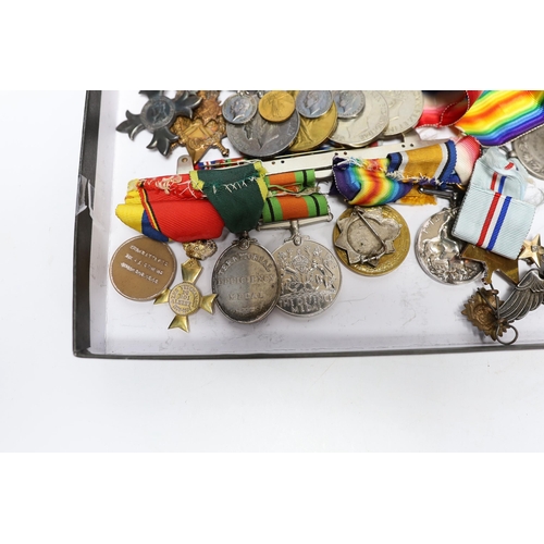 333 - A collection of eighteen medals and some associated miniatures; a WWI/WWII group including a militar... 