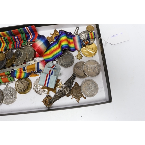 333 - A collection of eighteen medals and some associated miniatures; a WWI/WWII group including a militar... 