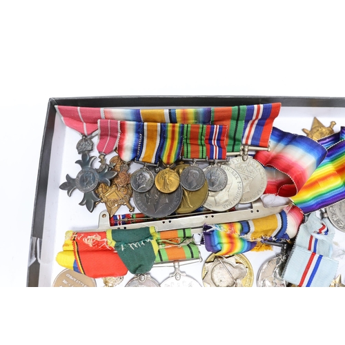 333 - A collection of eighteen medals and some associated miniatures; a WWI/WWII group including a militar... 