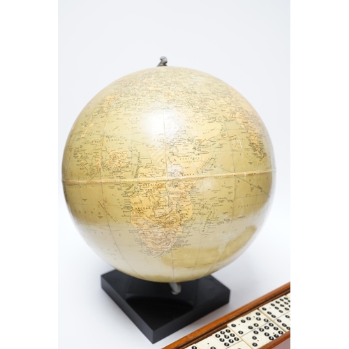 356 - A Philips 10" Challenge globe on stand and a cased set of dominoes, globe 32cm high