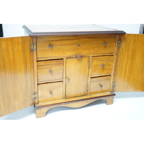 372 - An Edwardian inlaid sycamore two door jewellery chest, 29cm high x 31cm wide