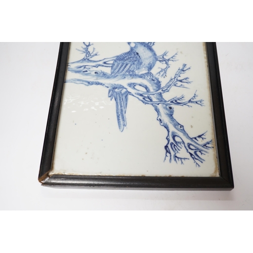 373 - A late 19th century Chinese blue and white plaque of a bird, ebonised frame, 19cm wide x 30cm high i... 