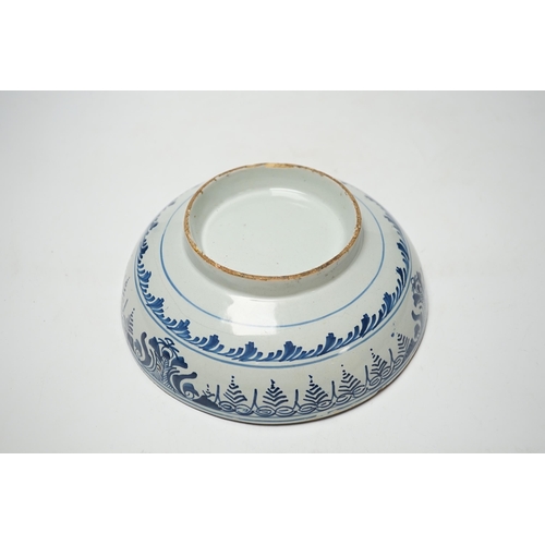 384 - An early 18th century Delft blue and white bowl, 20cm diameter