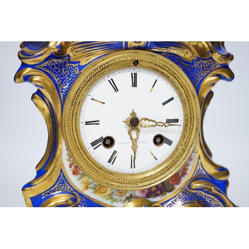 401 - An early 20th century French porcelain mantel clock, missing top section, 19cm