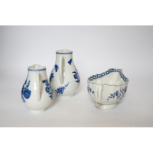 405 - A Worcester rose pattern sauceboat c.1770 and two three flowers pattern milk jugs, largest 18cm wide... 