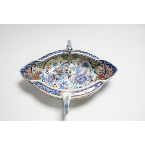 415 - A Chinese clobbered blue and white double lipped sauceboat, Qianlong period, 23cm high