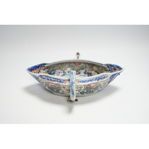 415 - A Chinese clobbered blue and white double lipped sauceboat, Qianlong period, 23cm high