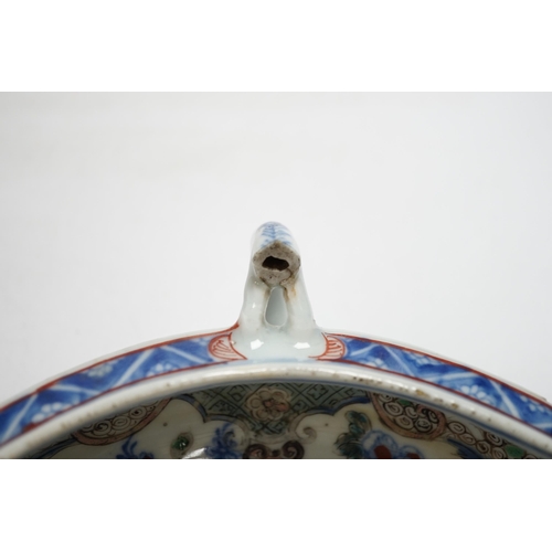 415 - A Chinese clobbered blue and white double lipped sauceboat, Qianlong period, 23cm high