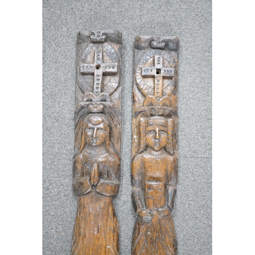 423 - Two 19th century, oak carvings, religious figures, 67cm high