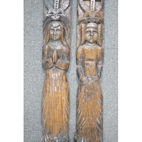 423 - Two 19th century, oak carvings, religious figures, 67cm high