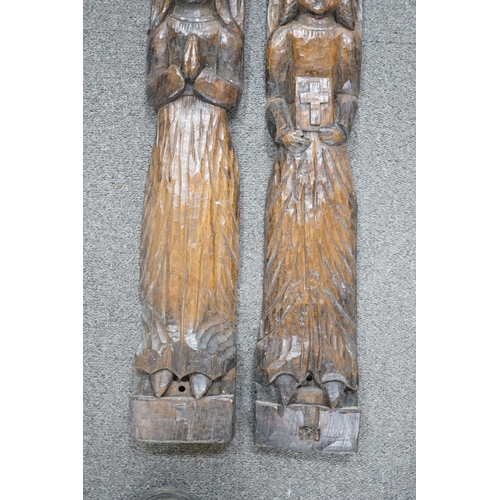 423 - Two 19th century, oak carvings, religious figures, 67cm high