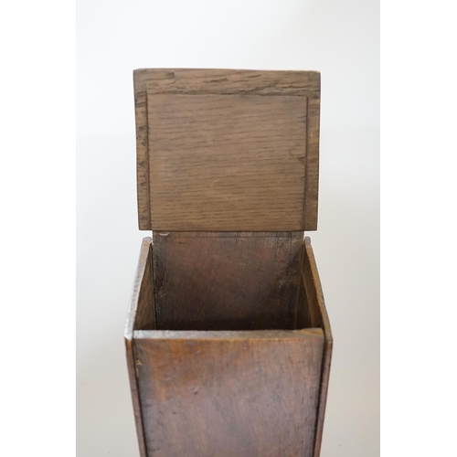 430 - A 18th / 19th century oak candle box, 38cm high