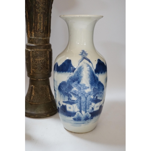 437 - A Chinese bronze gu vase, a 19th century Chinese blue and white vase and a Tibetan teapot, tallest 3... 