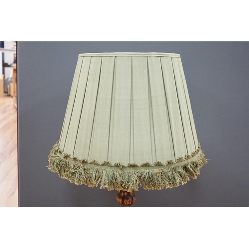 450 - An Italian column lamp with green fabric shade, 88cm high including the shade