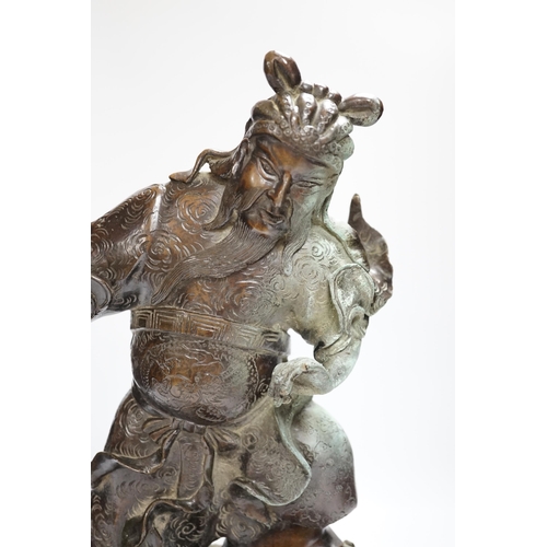 451 - A 19th century Japanese bronze figure of a warrior, raised on naturalist bronze base, 40cm high... 