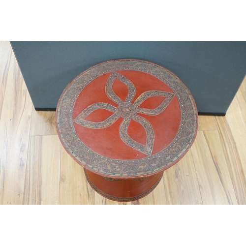 452 - A South East Asian composition red lacquered table inset mirrored sequins, 44cm high x 51cm in diame... 