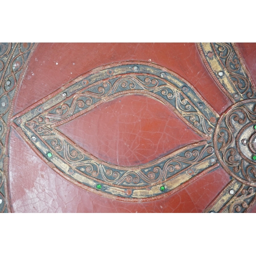 452 - A South East Asian composition red lacquered table inset mirrored sequins, 44cm high x 51cm in diame... 