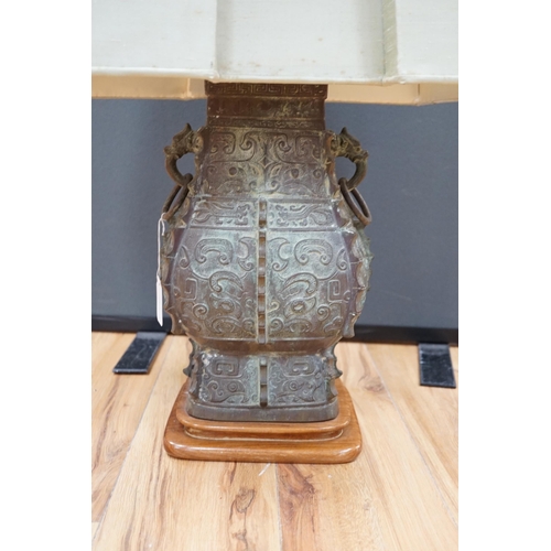 453 - A Chinese archaistic bronze zun lamp base, 84cm high including  shade