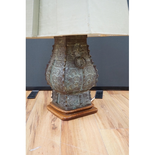 453 - A Chinese archaistic bronze zun lamp base, 84cm high including  shade