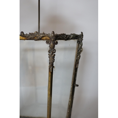 456 - A 19th century brass framed porch lamp with applied scrolled decoration, 65cm high